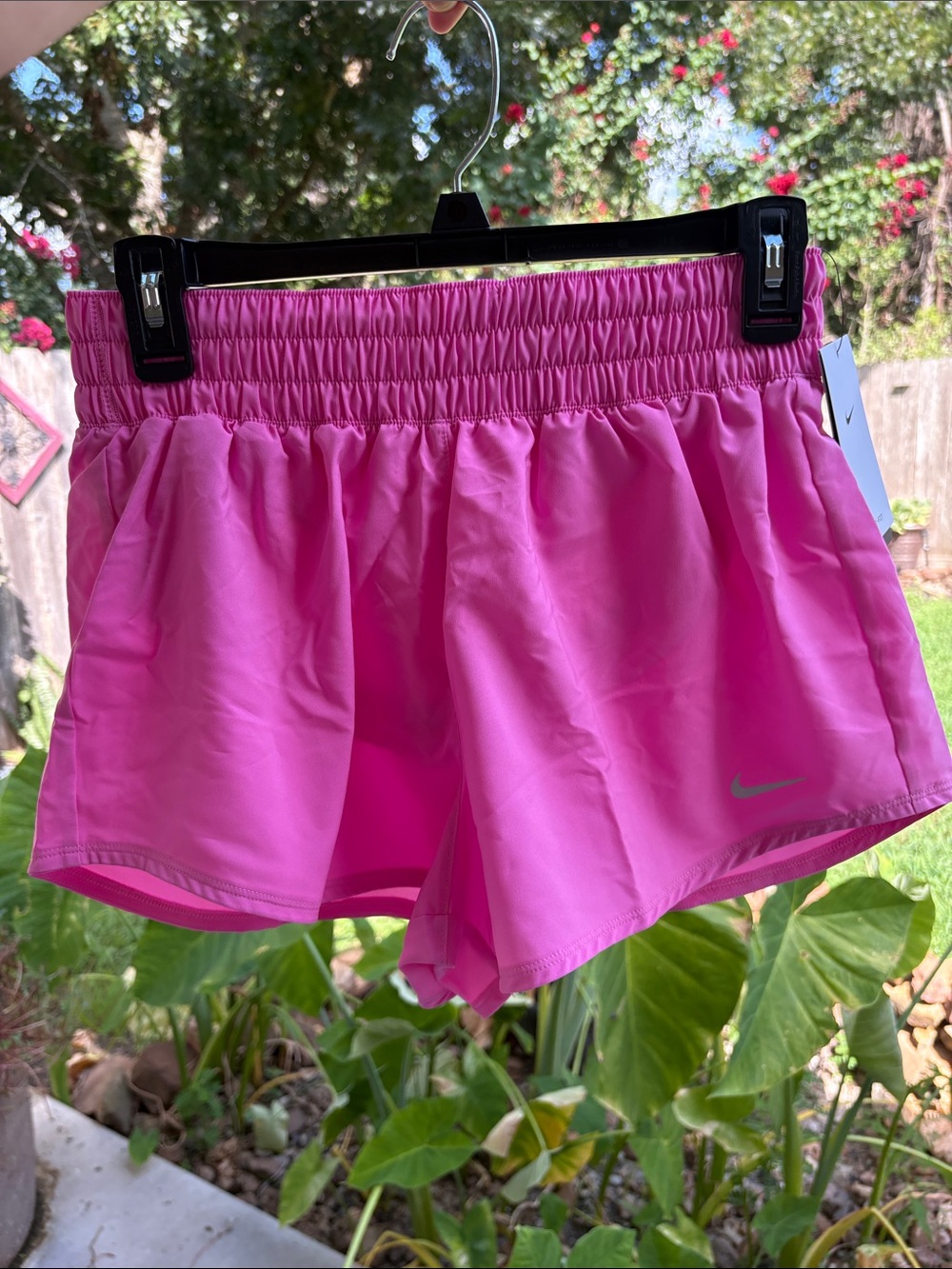 NIKE Women's Pink Athletic Running Shorts with Reflective Swoosh - Picture 16 of 16